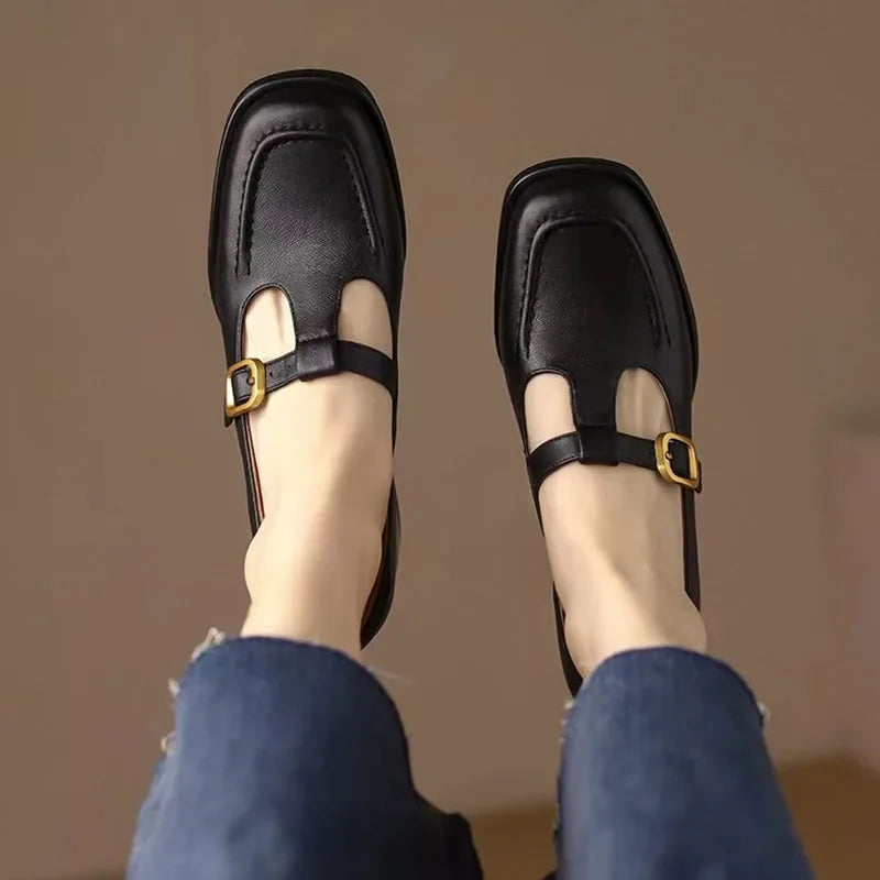 Black Ysolenne Classic Stylish T-Strap Pumps by THE WHITMORE FAMILY, elegant footwear with a T-strap design for women.