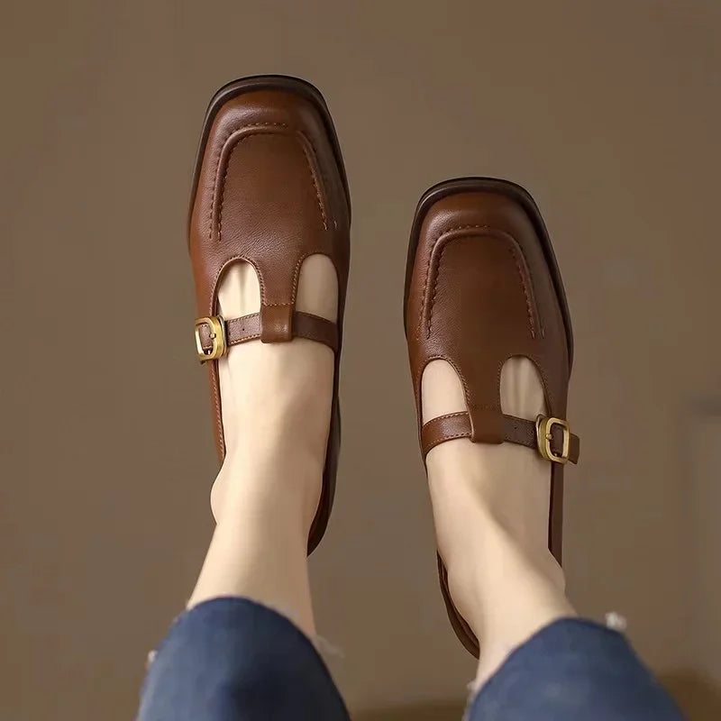 Black Ysolenne Classic Stylish T-Strap Pumps by THE WHITMORE FAMILY with sleek design and comfortable fit.