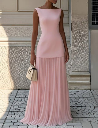 Cream Serena pleated maxi dress by THE WHITMORE FAMILY, flowing fabric with elegant pleats and a fitted bodice.