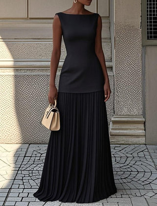 Cream Serena pleated maxi dress by THE WHITMORE FAMILY, flowing fabric with elegant pleats and a fitted bodice.