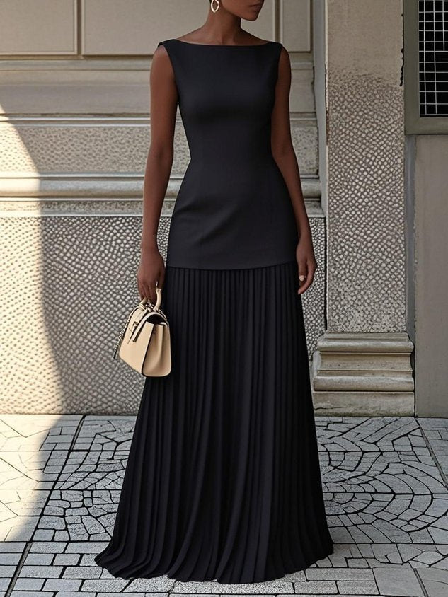 Cream Serena pleated maxi dress by THE WHITMORE FAMILY, flowing fabric with elegant pleats and a fitted bodice.