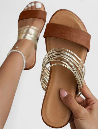 Cream white Lioraen™ elegant sandals by THE WHITMORE FAMILY, featuring stylish straps and a comfortable flat sole.