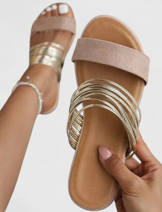 Cream white Lioraen™ elegant sandals by THE WHITMORE FAMILY, featuring stylish straps and a comfortable flat sole.