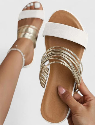 Cream white Lioraen™ elegant sandals by THE WHITMORE FAMILY, featuring stylish straps and comfortable design.