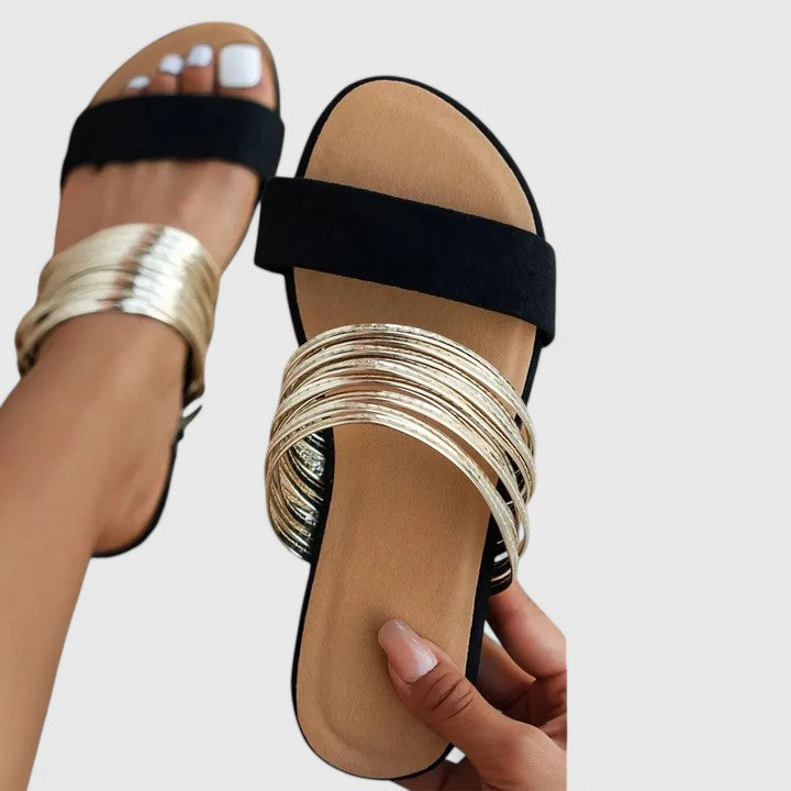 Cream white Lioraen™ elegant sandals by THE WHITMORE FAMILY, featuring stylish straps and a comfortable design.