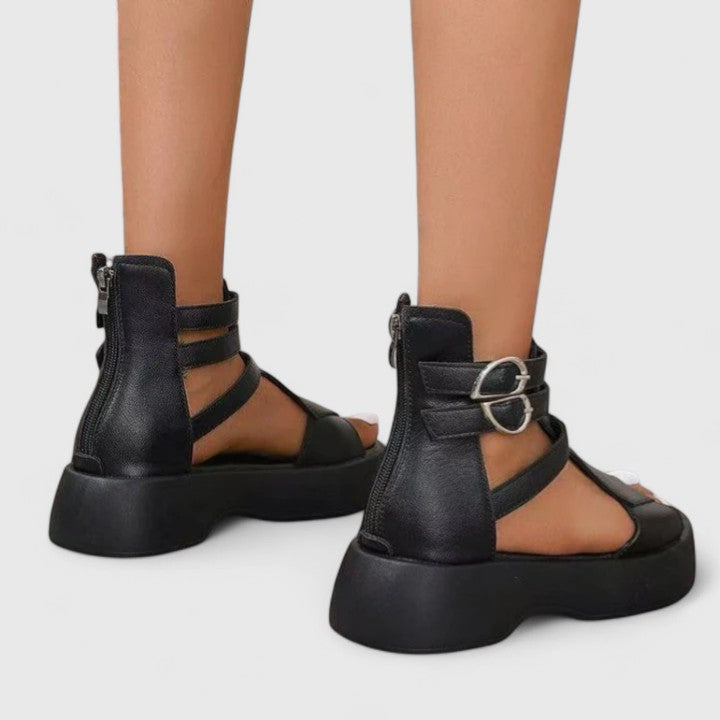 Black Ivana™ orthopedic sandals for women by THE WHITMORE FAMILY, featuring supportive design and comfortable straps.