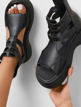 Black Ivana™ orthopedic sandals for women by THE WHITMORE FAMILY, featuring comfortable straps and supportive sole design.