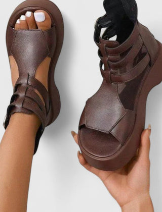 Black Ivana™ orthopedic sandals for women by THE WHITMORE FAMILY, showcasing comfortable, supportive footwear with textured straps.