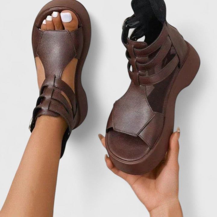 Black Ivana™ orthopedic sandals for women by THE WHITMORE FAMILY, showcasing comfortable, supportive footwear with textured straps.