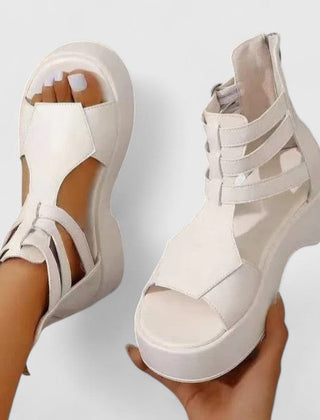 Black Ivana™ orthopedic sandals for women from THE WHITMORE FAMILY, featuring supportive straps and cushioned soles.