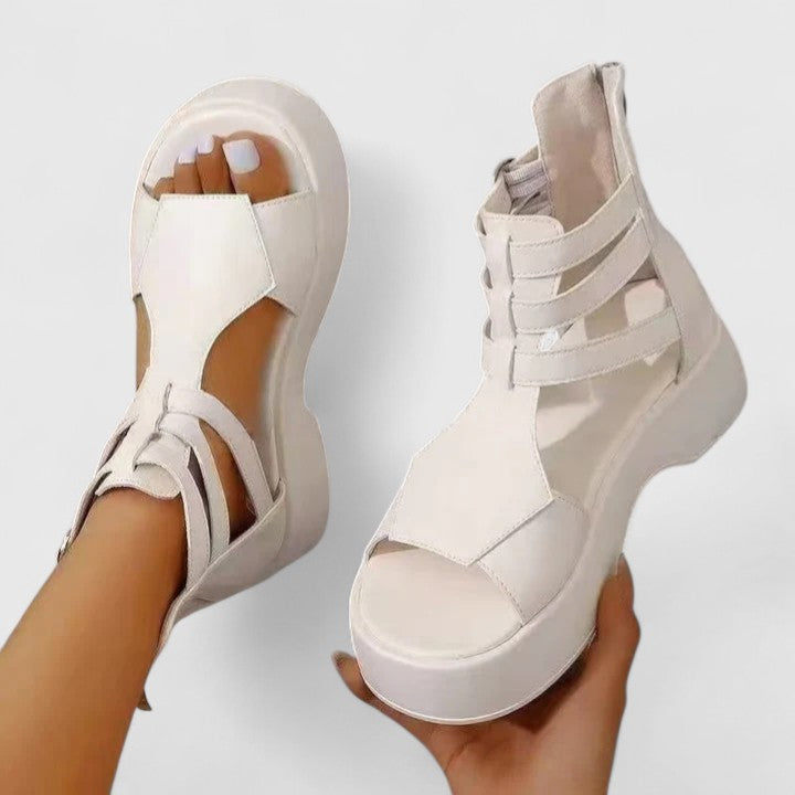 Black Ivana™ orthopedic sandals for women from THE WHITMORE FAMILY, featuring supportive straps and cushioned soles.