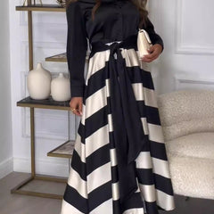 Diana striped maxi dress by THE WHITMORE FAMILY, burgundy damesjurk with vertical white and black stripes, full-length style.