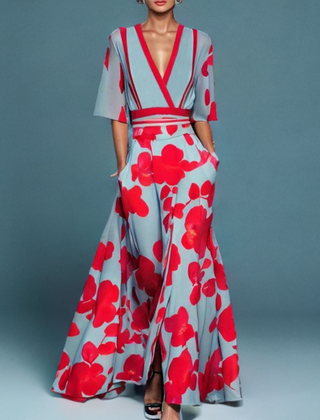Red Barbara elegant flower dress for women by THE WHITMORE FAMILY, featuring a stylish floral pattern and feminine silhouette.
