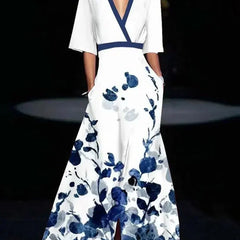 Red Barbara elegant flower dress for women by THE WHITMORE FAMILY, showcasing a stylish and sophisticated design.