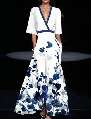 Red Barbara elegant flower dress for women by THE WHITMORE FAMILY, showcasing a stylish and sophisticated design.