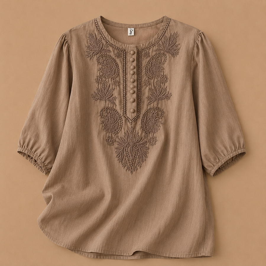Verena cotton linen blouse by THE WHITMORE FAMILY, featuring a relaxed fit with short sleeves and a button-front design.