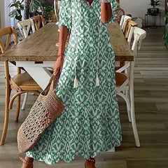 Beige Lana boho maxi dress by THE WHITMORE FAMILY, figure-flattering style with flowing fabric and bohemian design.