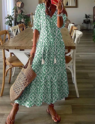 Beige Lana boho maxi dress by THE WHITMORE FAMILY, figure-flattering style with flowing fabric and bohemian design.