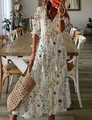 Beige Lana boho maxi dress by THE WHITMORE FAMILY, figure-flattering silhouette with flowing fabric and bohemian style.
