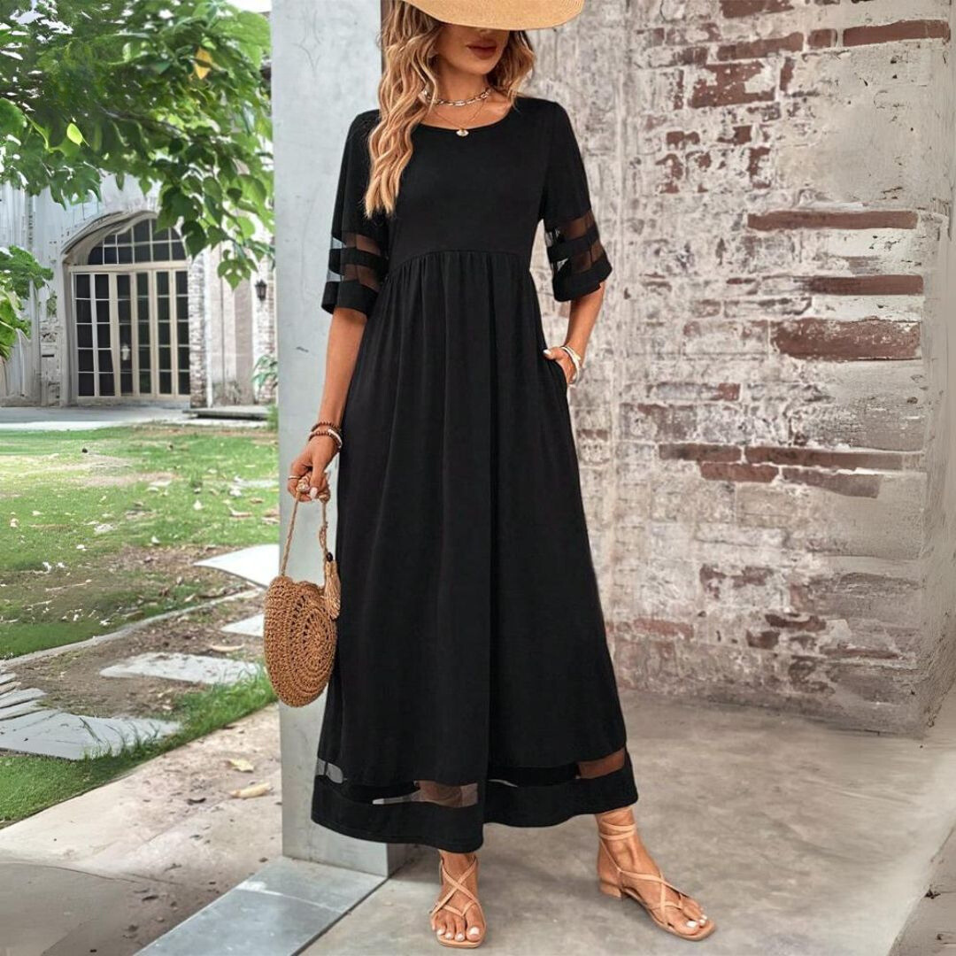 Black Aubrey mid-length dress by THE WHITMORE FAMILY, flattering tummy-smoothing fit, elegant midi design for stylish occasions.