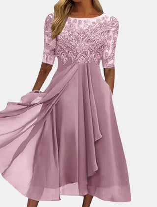 Blue lace dress named Rhonda by THE WHITMORE FAMILY, featuring elegant detailing and a stylish fit.