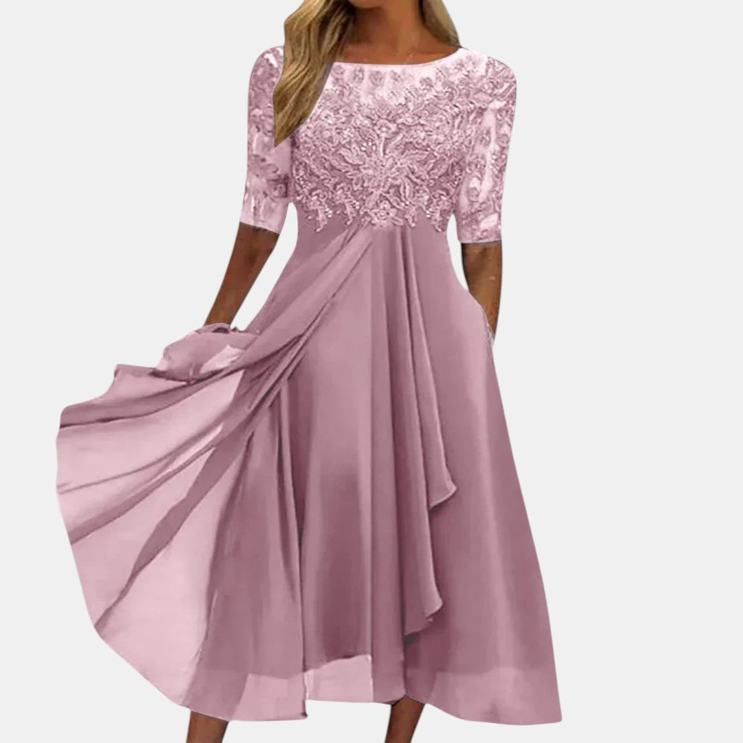Blue lace dress named Rhonda by THE WHITMORE FAMILY, featuring elegant detailing and a stylish fit.