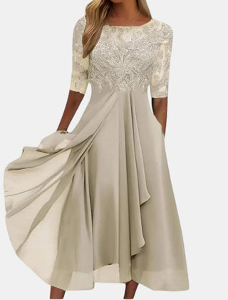Blue Rhonda elegant lace dress by THE WHITMORE FAMILY, showcasing intricate lace details and a sophisticated fit.