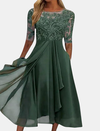 Blue lace dress named Rhonda by THE WHITMORE FAMILY featuring elegant lace fabric and a stylish, fitted silhouette.