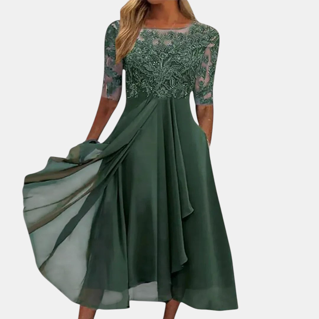Blue lace dress named Rhonda by THE WHITMORE FAMILY featuring elegant lace fabric and a stylish, fitted silhouette.