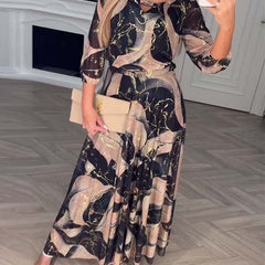 Brown printed chiffon dress by THE WHITMORE FAMILY featuring a flowing design and elegant style.