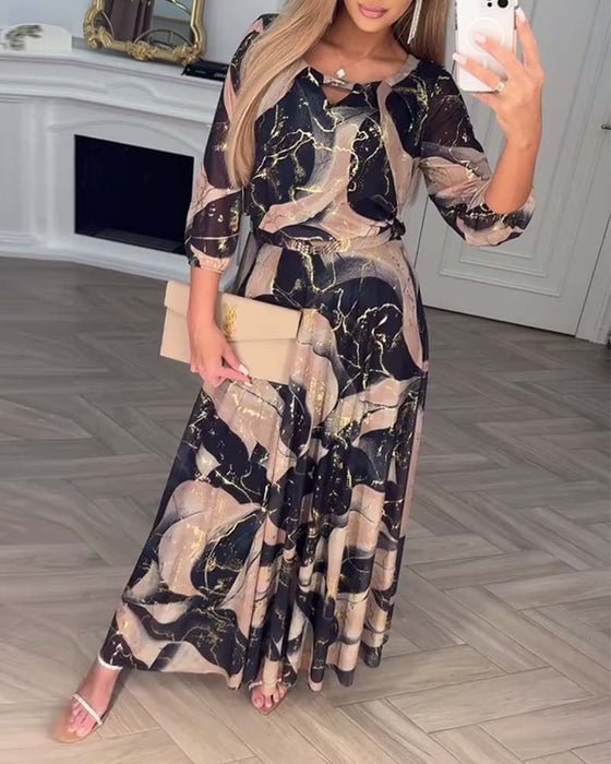 Brown printed chiffon dress by THE WHITMORE FAMILY featuring a flowing design and elegant style.