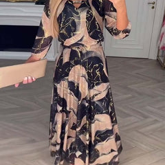 Camille printed chiffon dress by THE WHITMORE FAMILY, featuring a flowy brown fabric and elegant design for stylish occasions.