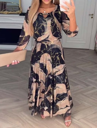 Camille printed chiffon dress by THE WHITMORE FAMILY, featuring a flowy brown fabric and elegant design for stylish occasions.
