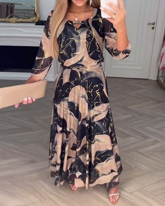 Camille printed chiffon dress by THE WHITMORE FAMILY, featuring a flowy brown fabric and elegant design for stylish occasions.