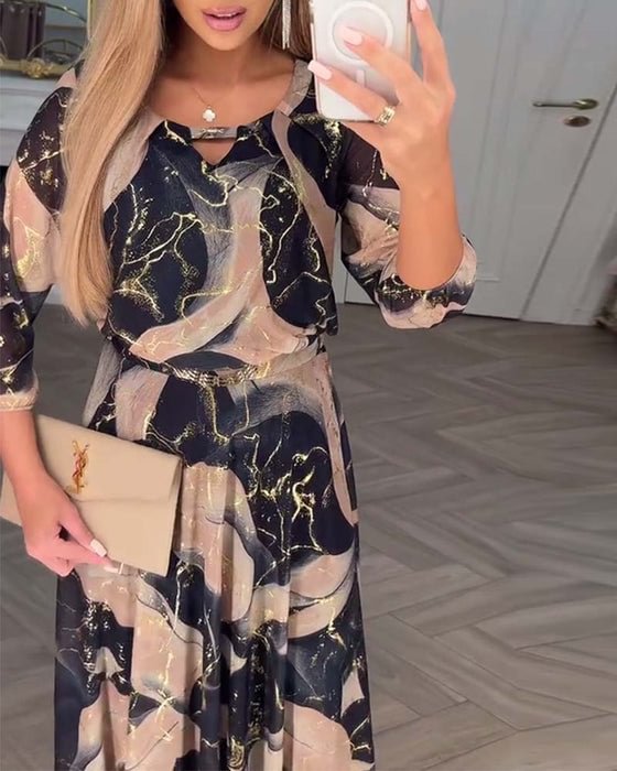 Brown Camille printed chiffon dress by THE WHITMORE FAMILY, flowing fabric with floral pattern and elegant design.