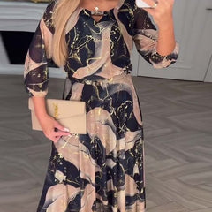 Brown printed chiffon dress named Camille by THE WHITMORE FAMILY, featuring flowing fabric and elegant design.