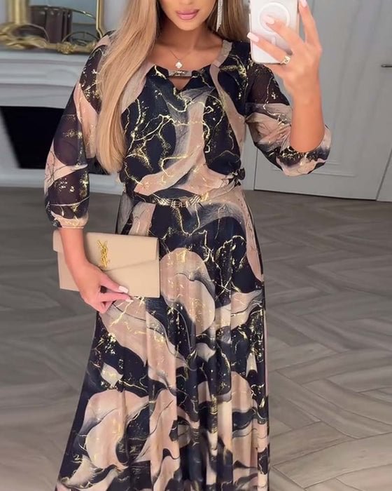 Brown printed chiffon dress named Camille by THE WHITMORE FAMILY, featuring flowing fabric and elegant design.