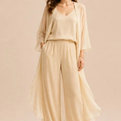 Elegant dress set featuring a refined camisole, chiffon jacket, and matching pants by THE WHITMORE FAMILY, in champagne color.