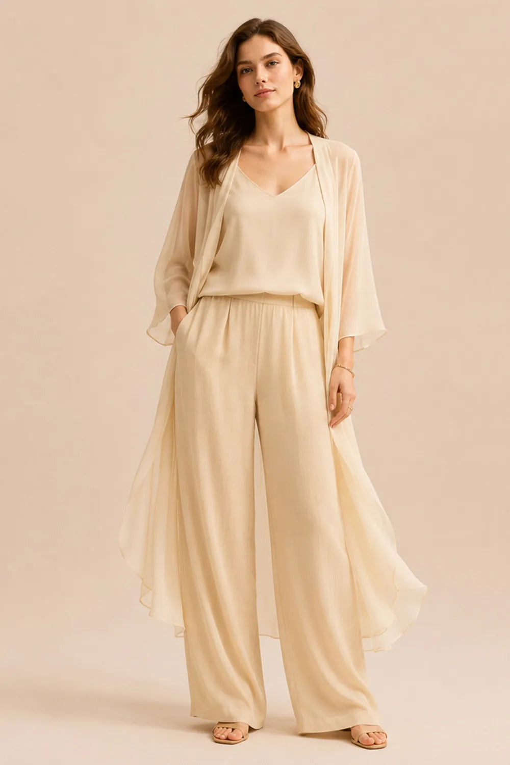 Elegant dress set featuring a refined camisole, chiffon jacket, and matching pants by THE WHITMORE FAMILY, in champagne color.