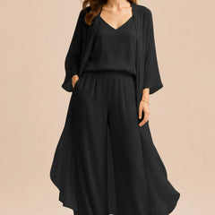 Elegant champagne dress by THE WHITMORE FAMILY featuring a refined camisole, chiffon jacket, and matching pants, perfect for formal occasions.