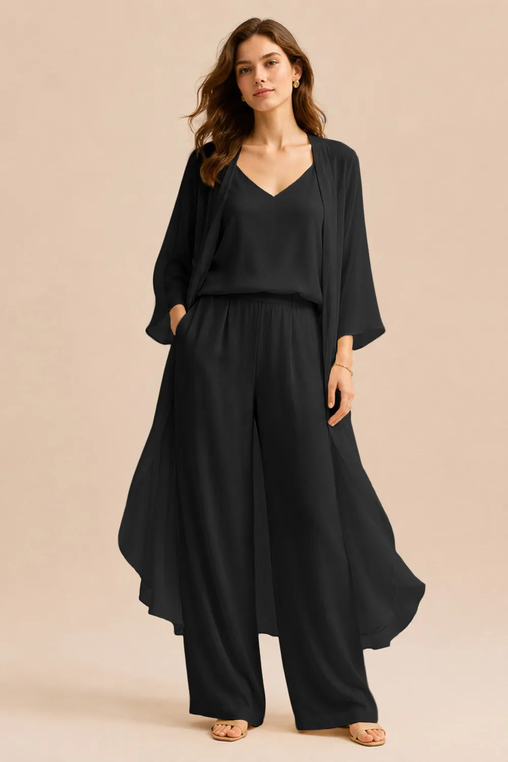 Elegant champagne dress by THE WHITMORE FAMILY featuring a refined camisole, chiffon jacket, and matching pants, perfect for formal occasions.