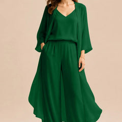 Elegant champagne-colored dress featuring a refined camisole and chiffon jacket with matching pants by THE WHITMORE FAMILY.