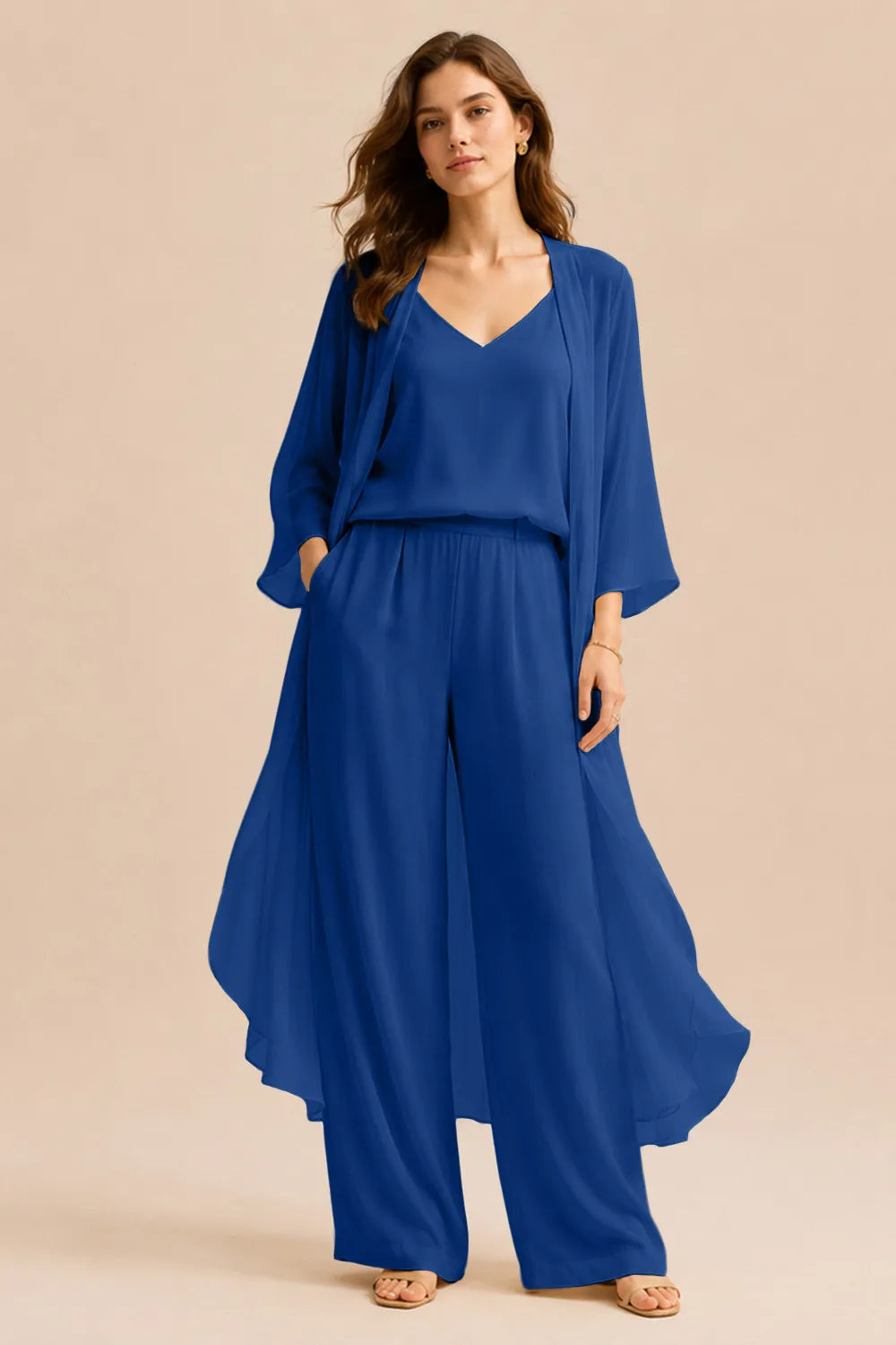 Elegant champagne-colored dress by THE WHITMORE FAMILY featuring a refined camisole, chiffon jacket, and matching pants.