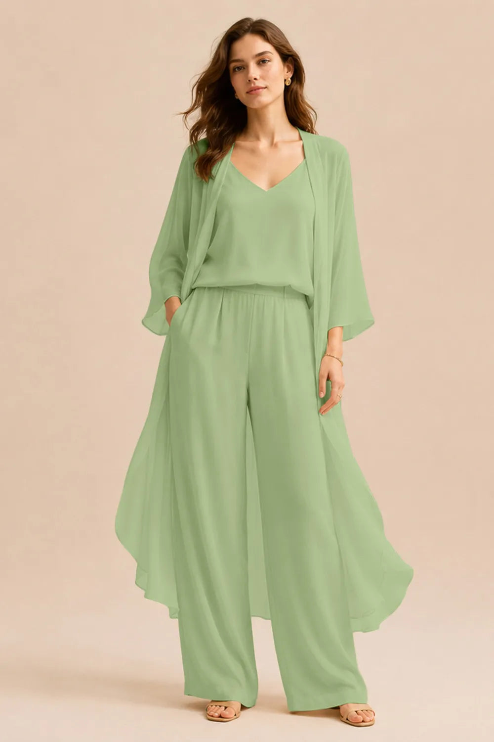 Elegant champagne-colored dress set with a refined camisole, chiffon jacket, and matching pants by THE WHITMORE FAMILY.