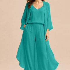 Elegant champagne-colored dress by THE WHITMORE FAMILY featuring a refined camisole, chiffon jacket, and matching pants.