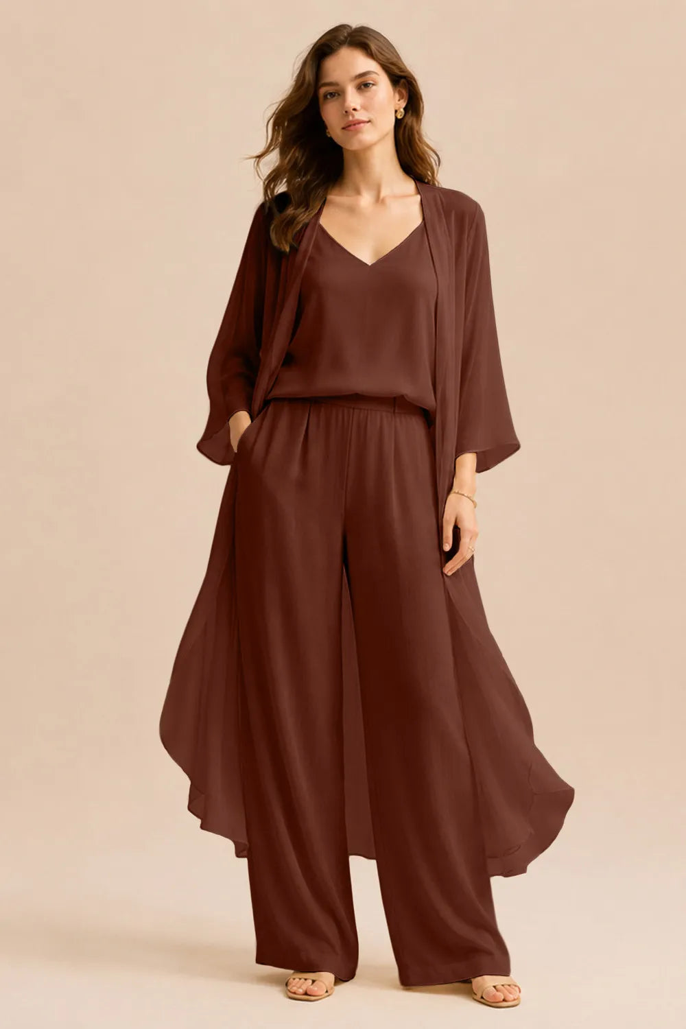 Elegant champagne dress set by THE WHITMORE FAMILY featuring a refined camisole, chiffon jacket, and matching pants.