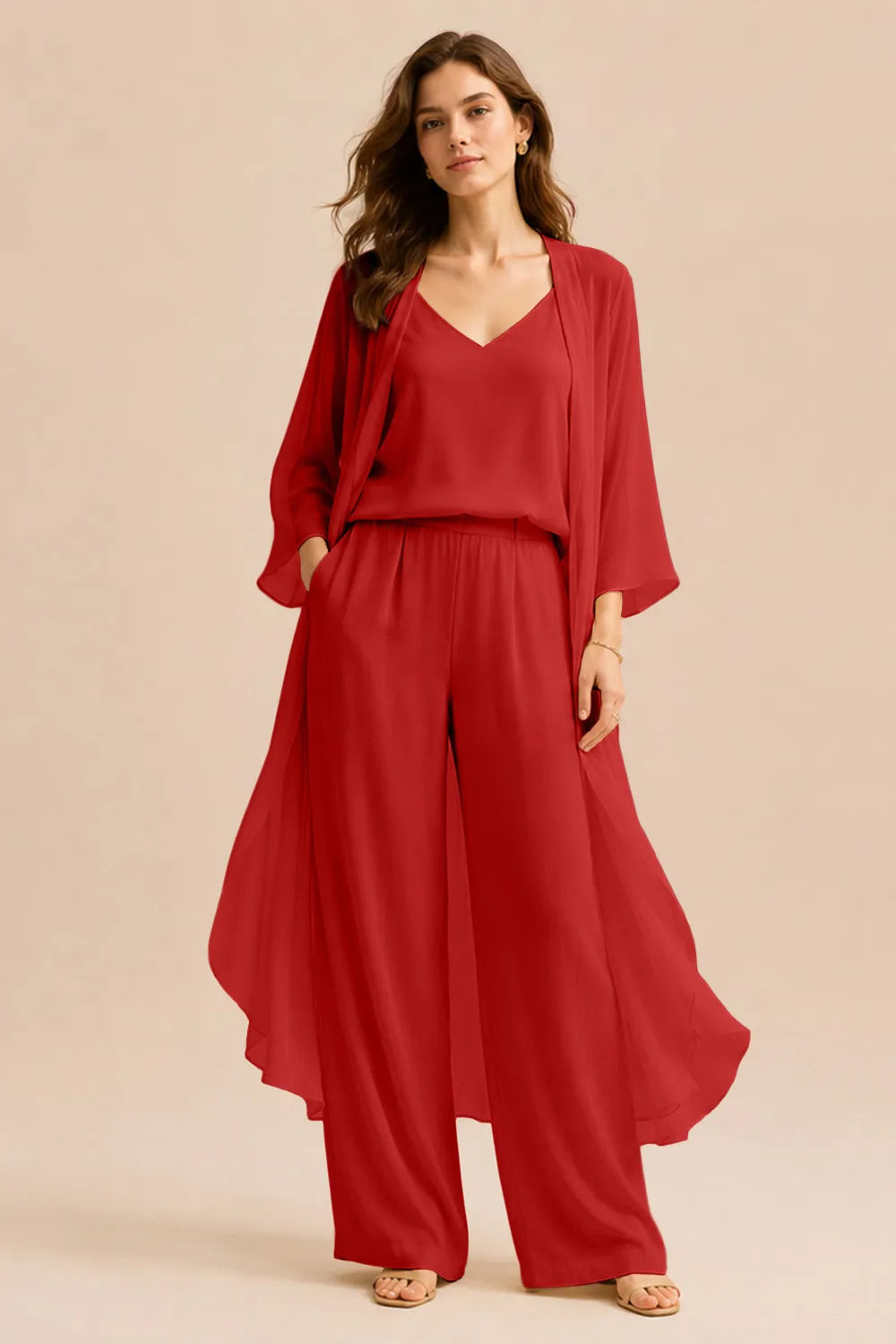 Elegant champagne dress by THE WHITMORE FAMILY featuring a refined camisole, chiffon jacket, and matching pants.