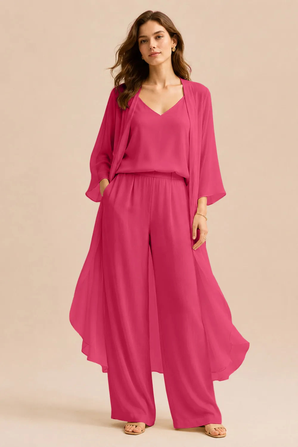 Elegant champagne dress featuring a refined camisole and chiffon jacket with matching pants from THE WHITMORE FAMILY.
