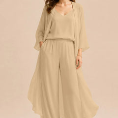 Elegant champagne dress by THE WHITMORE FAMILY featuring a refined camisole, chiffon jacket, and matching pants.