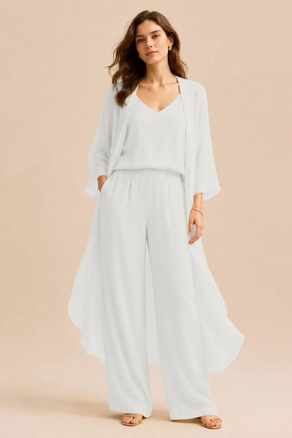 Elegant champagne dress by THE WHITMORE FAMILY featuring a refined camisole, chiffon jacket, and matching pants.